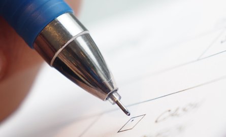 Submit a complaint A pen on paper.