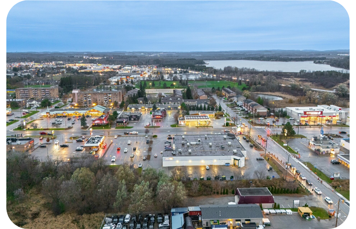 An aerial shot of a small town and main roadway