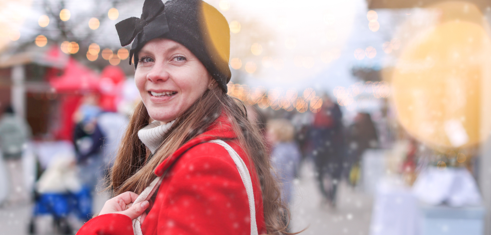 Exterior of a brick town hall building with holiday tree